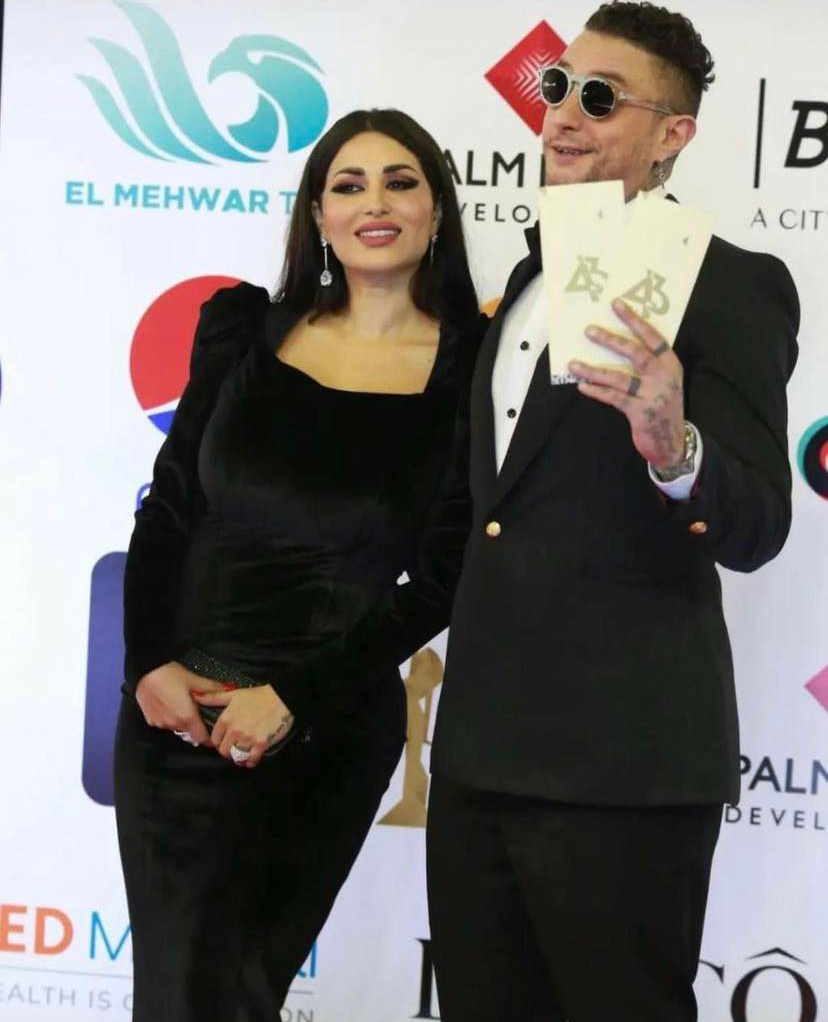 أحمد الفيشاوي وزوجته من مهرجان القاهرة السنمائي الدولي